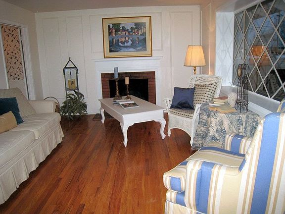 LIVING ROOM W/HARDWOOD FLOORS  AND FIREPLACE