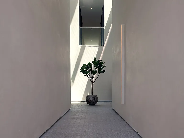 Private Courtyard _ A striking balance of light and shadow, this sculptural courtyard integrates architectural precision with a sense of openness, leading seamlessly into the residence.