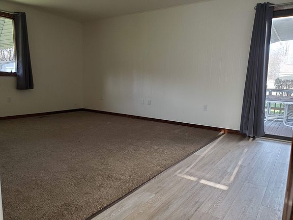 Large family room with sliding glass door to deck