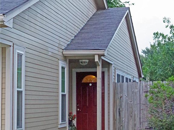 Front entry with covered porch and beautifully landscaped
