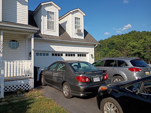 2 car garage with room for 4 more in driveway & street parking available