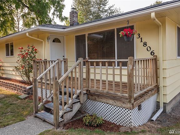 The home is nicely set back from the Issaquah Fall City Road; the front entrance features a porch deck