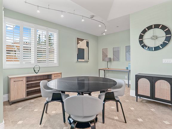 Dining Table - Credenza and Working Desk Area

4 person seating for dining table 
4 person seating at Breakfast Bar (Leather Stools)