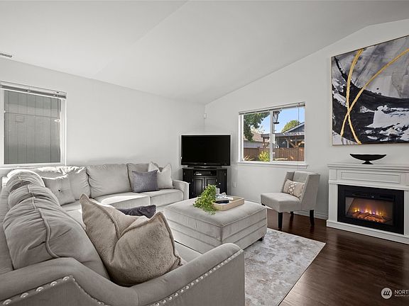 Family room with a feature fireplace.>