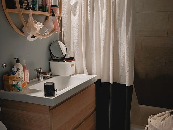 View of Bathroom. Will swap out storage fixture for mirror upon move out.