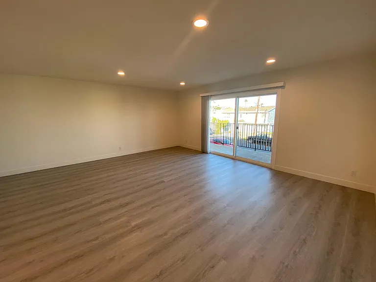 Large living room with recessed lighting.