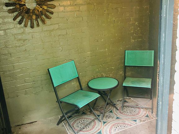 Covered outdoor seating area - can be gated for secure outdoor bike storage!