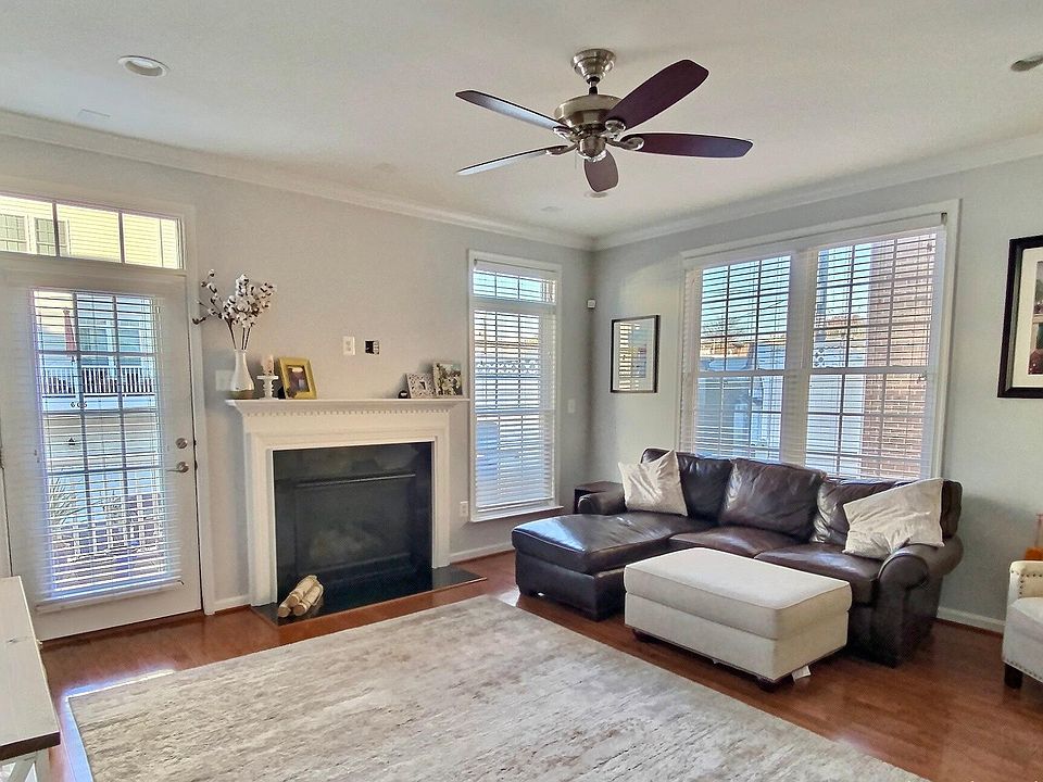 Main living area with gas fireplace and back balcony/deck