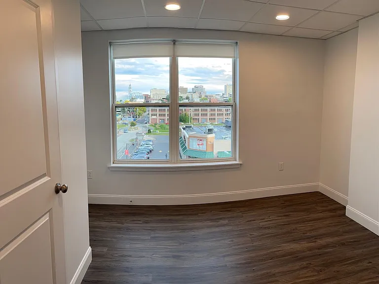 The bedroom of apartment 425 - The Linden's special top floor, corner one-bedroom with amazing city and Back Cove views!
