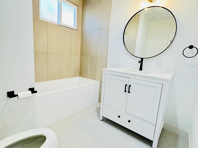Newly tiled bathroom and fixtures.