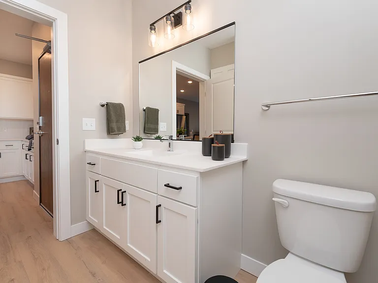 Light finishes and modern fixtures create a clean, functional space.