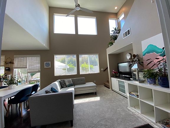 Great room gets lots of natural light. Built in media cabinet provides great storage.