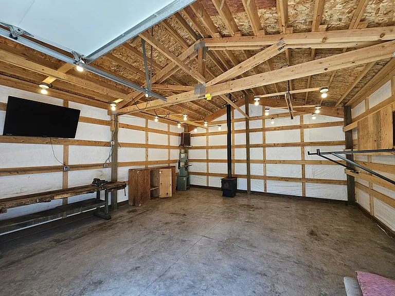 Incredible 48x20 shop (wood stove will be removed). TV will stay.