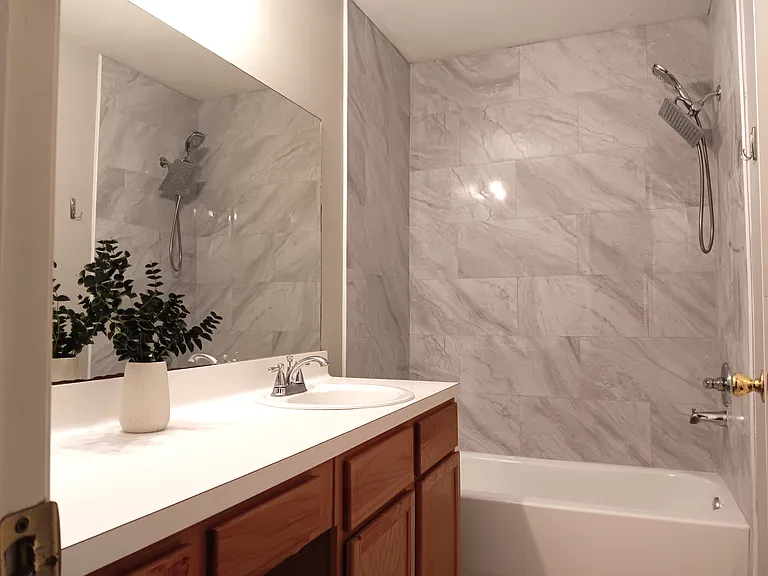En-suite master bathroom - new bath tub and tile installed.