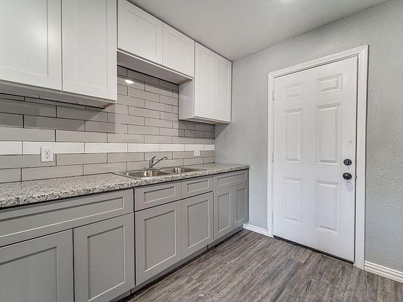 Kitchen - With it's newly installed backsplash and cabinets!