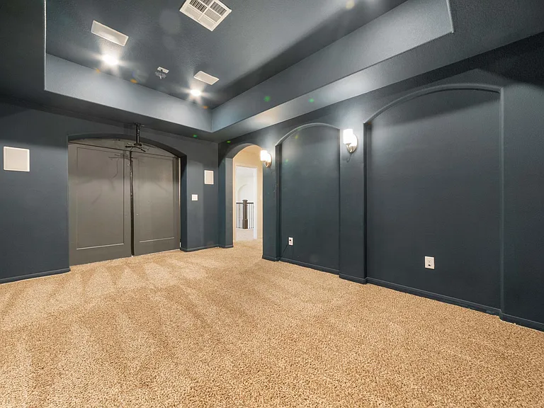 Media room with speaker system and barn doors