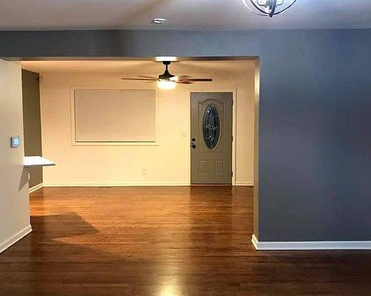 Living/Dining with room for large dining table a massive fan and overhang for a couple bar stools.