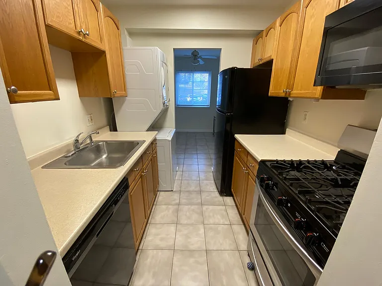Kitchen with gas 5 burner stove and tile floors