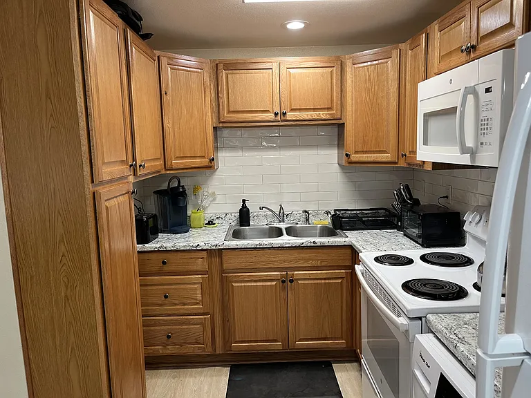 Another view of kitchen. Lots of storage space. Includes pantry cabinet