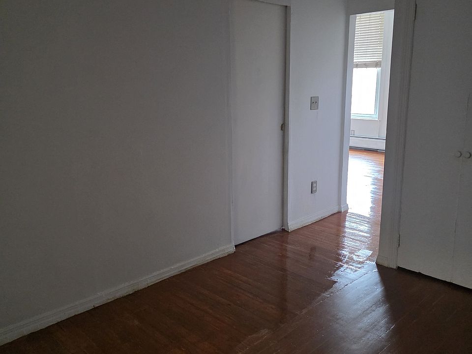 Middle room. Bedroom door can be seen in the picture.