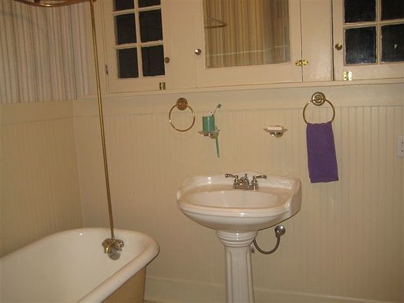 Bathroom with Built-Ins and Antique Tub