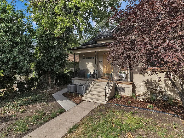 Fully fenced yard with porch