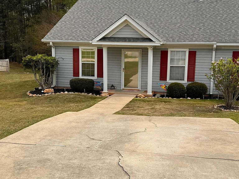 Large Parking area, landscaping maintained by HOA including Shrubs
