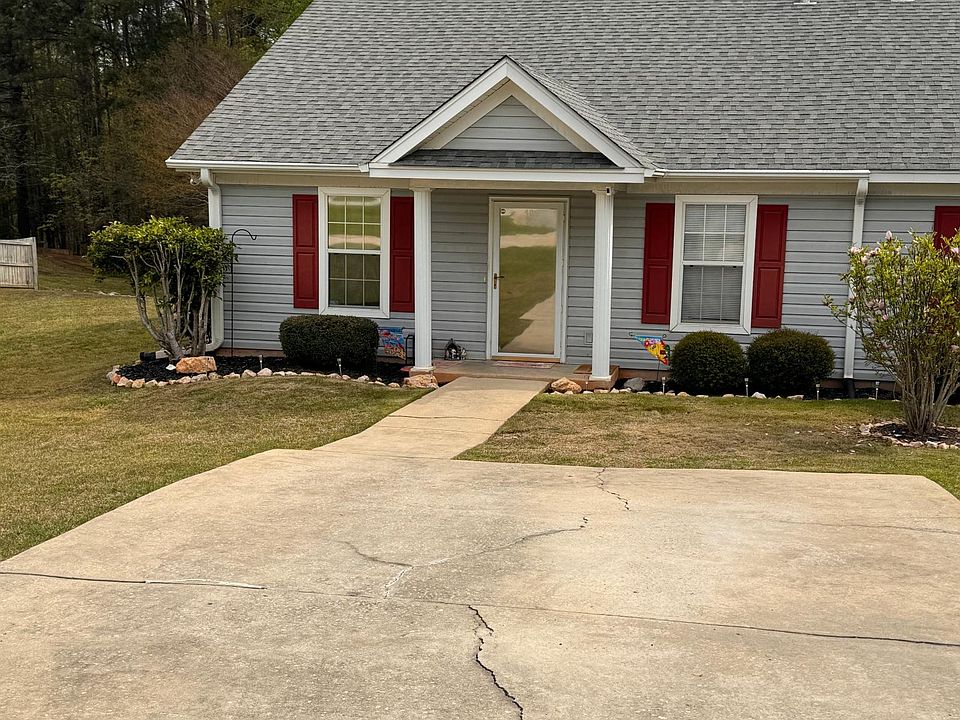 Large Parking area, landscaping maintained by HOA including Shrubs