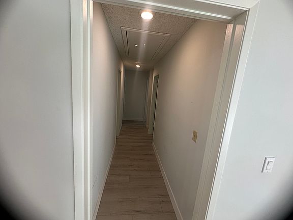 Hallway leading to the 3 bedrooms