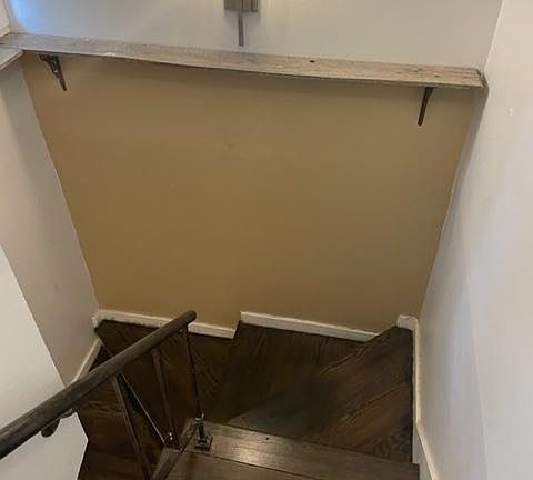 Townhouse stairs leading to the two bedrooms upstairs and one full bathroom