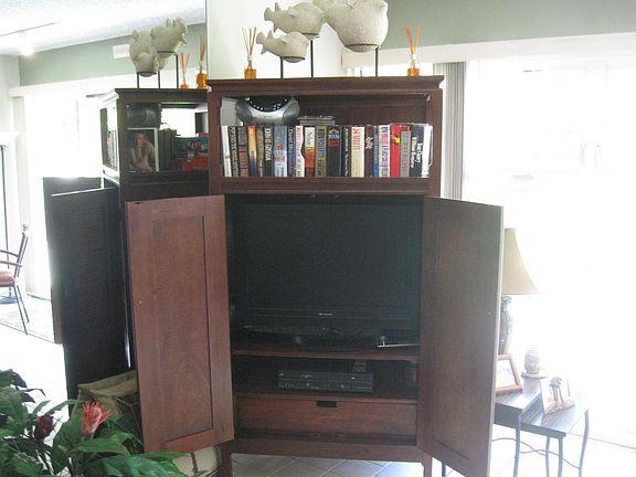 Armoire with TV in living room