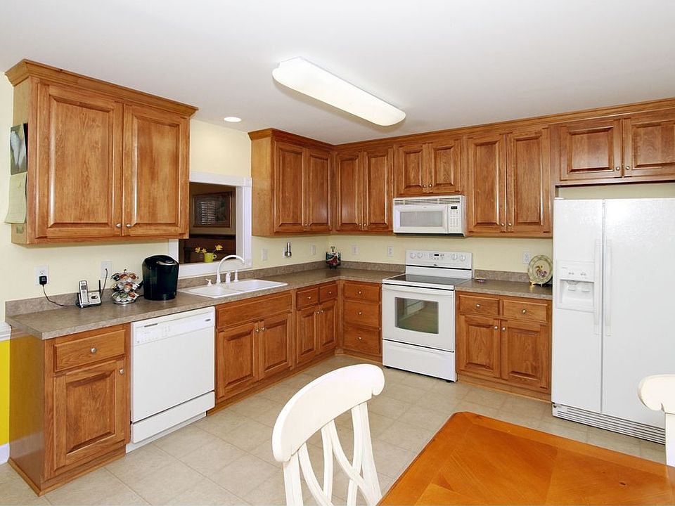 Beautiful, solid wood cabinetry provides ample storage & counter surface.