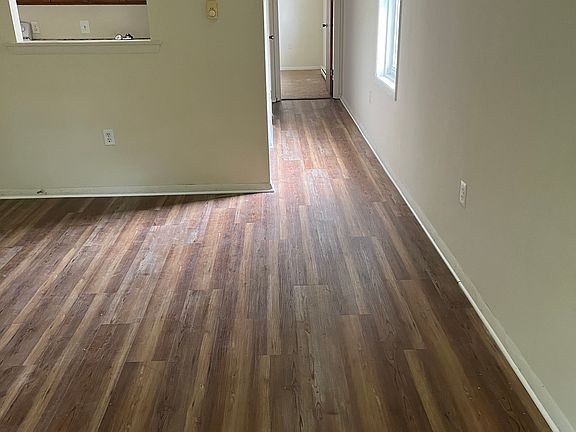 living room looking towards hallway leading to bedroom