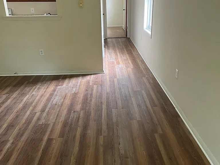 living room looking towards hallway leading to bedroom