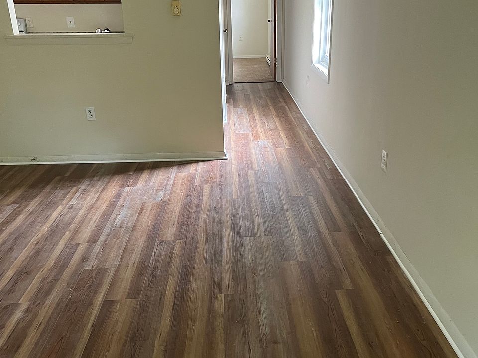 living room looking towards hallway leading to bedroom