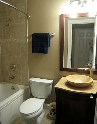 Hall Bath with Travertine Tile and Sink