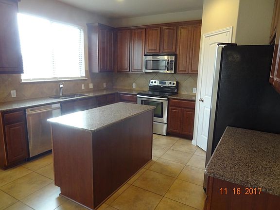 Kitchen with window to back yard