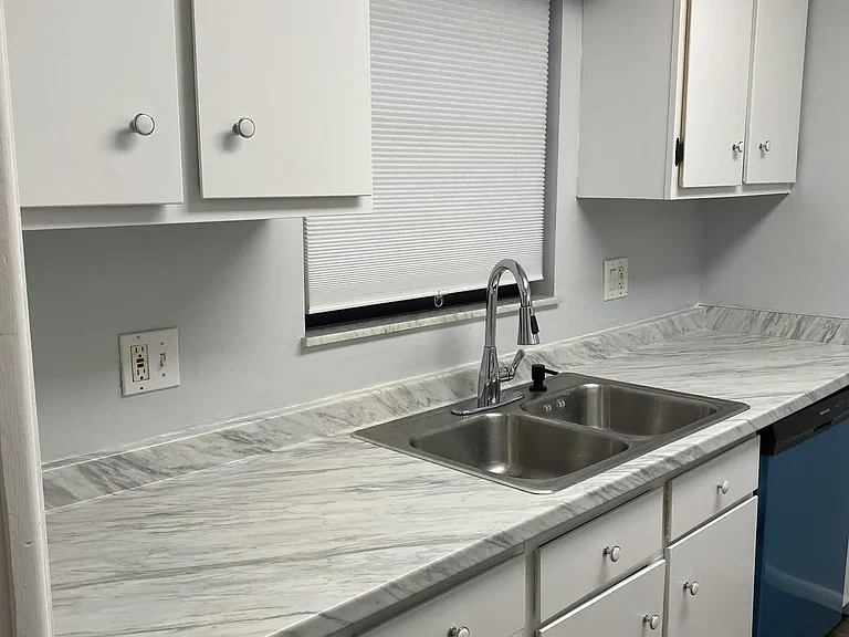 New Counter top and cabinets re-painted