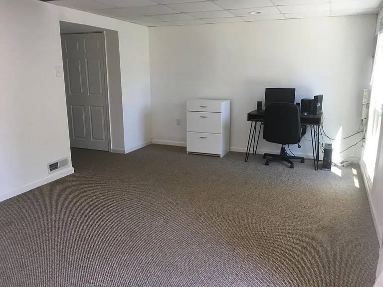 Finished basement with a storage closet