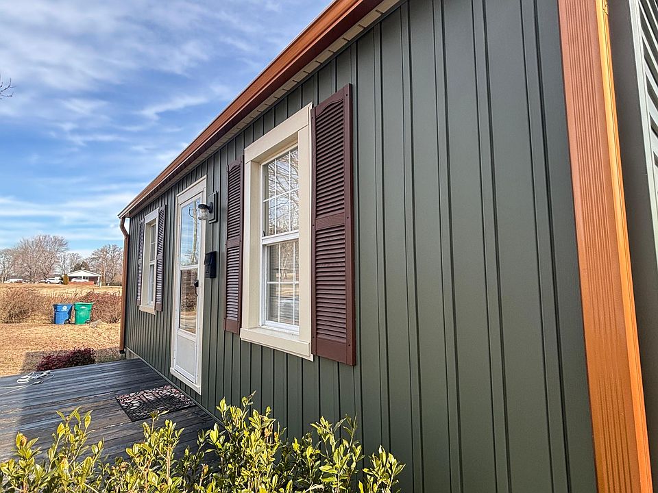 With newer siding. Bottom portion of home will be painted to match siding, prior to next tenancy. Deck will be repainted/repaired prior to next tenancy.