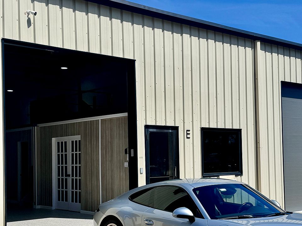 Large drive- in warehouse door with glass office entry door
