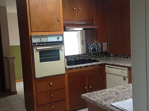 Kitchen w/ granite counters.
