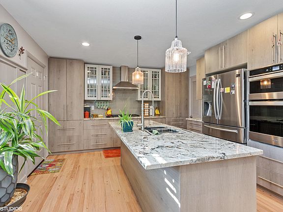 Newly remodeled kitchen with soft close doors! All new appliances, granite countertops, glass subway tile, gas cooktop with grill, and tons of storage!