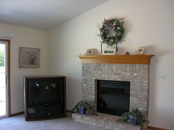 Living room accented w/fireplace