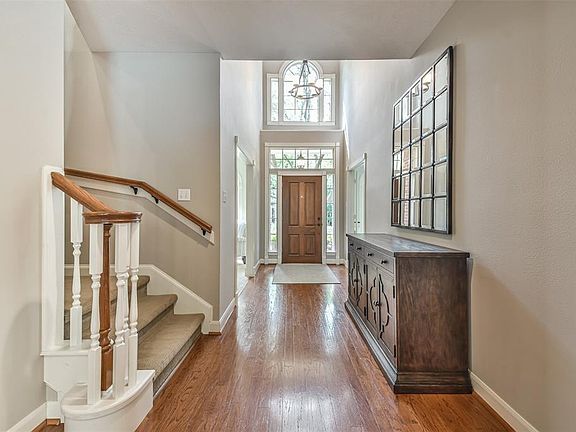 The stunning entry into the home boasts high ceilings and many windows to let in natural lights