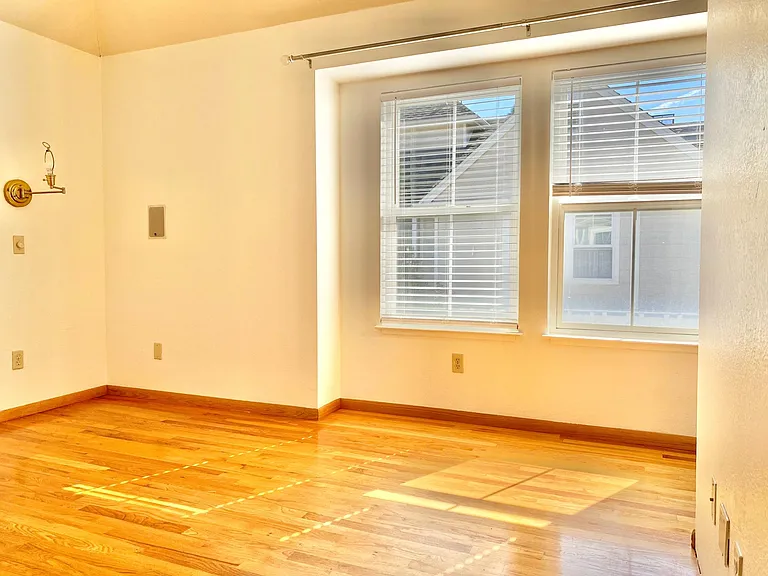Sunlit primary bedroom