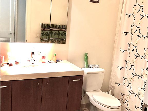 1 bathroom. Across from the bathroom is the stacked washer and dryer.