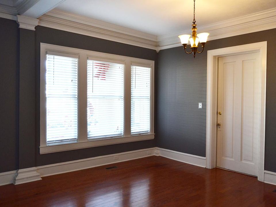 Front room is a living room with large windows and beautiful