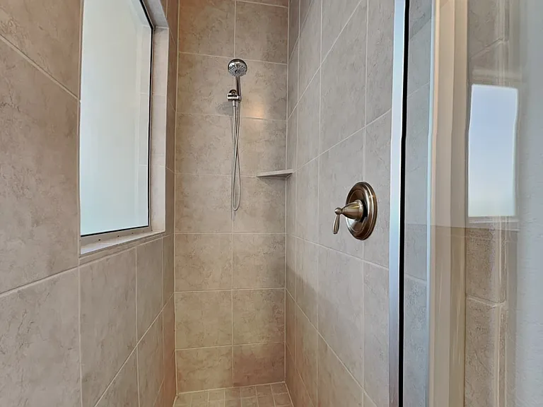 Modern bathroom with beige mar