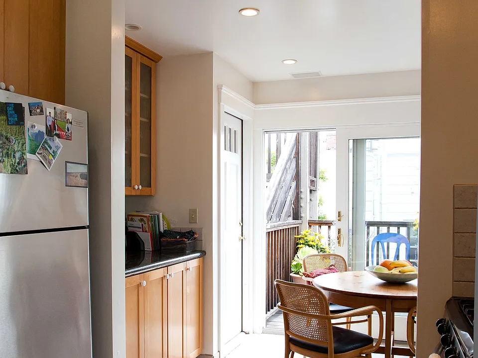 Kitchen (in unit washer dryer behind cabinet doors to left of table)